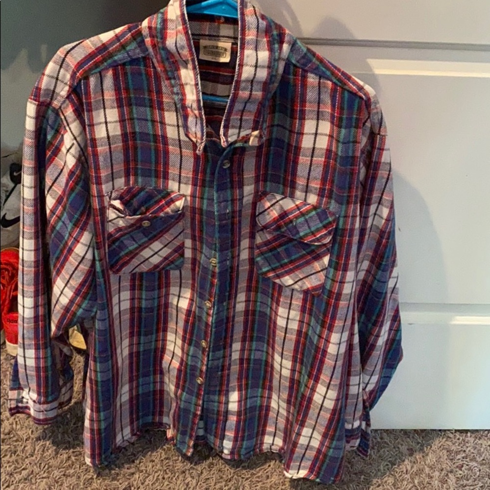 Plaid button down shirt.